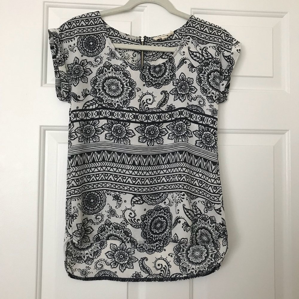 White and navy geometric floral print top